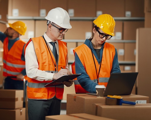 warehouse-workers-checking-orders-laptop_1176719-3635